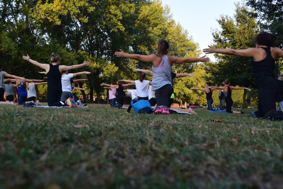 group of individuals doing a pilates class